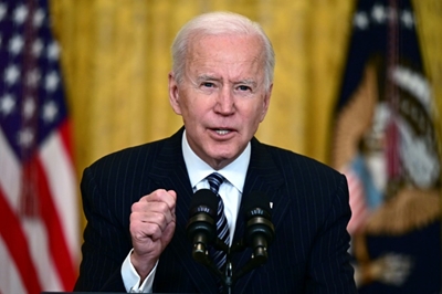 Flying solo: Biden to hold his first press conference
