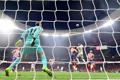 Real hold off Atletico in tight derby to grab top spot in Spain