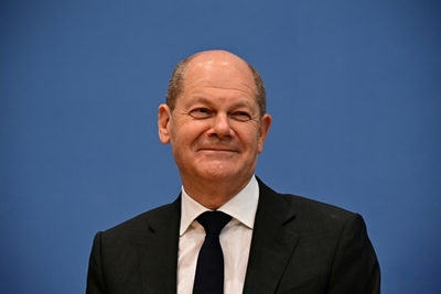 Scholz takes reins from Merkel for new German era