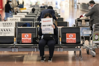 Japan slams borders shut as world races to stem new Covid variant