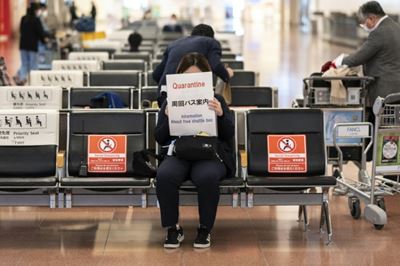 Japan slams borders shut as world races to stem new Covid variant