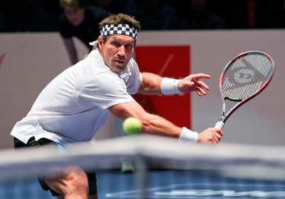 Real men don't play football, says tennis great Cash
