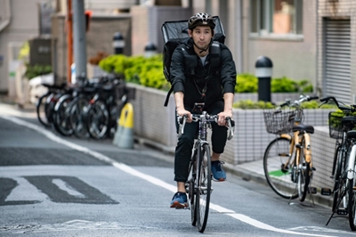 From medals to pedals: Japan Olympic fencer turns to food delivery