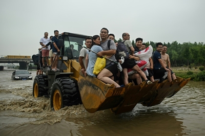 Villagers flee fresh floods in central China as typhoon approaches