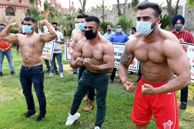 India's bodybuilders flex muscles, call for gyms to open