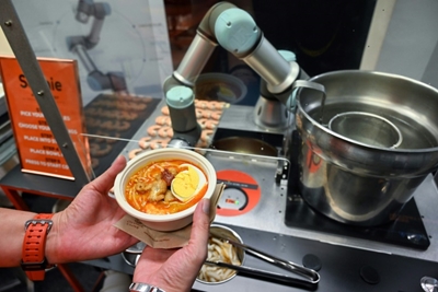 Sophie the robot whips up oodles of Singapore noodles 