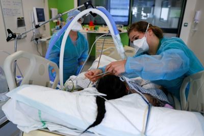 Pregnant and young among critically ill at swamped French hospital