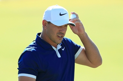 Koepka out of Presidents Cup with knee injury