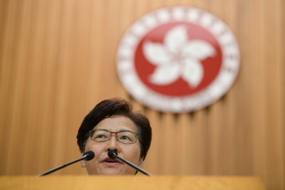 Hong Kong leader insists she will stay on