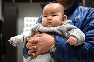 Given the right to larger families, Chinese may hold off