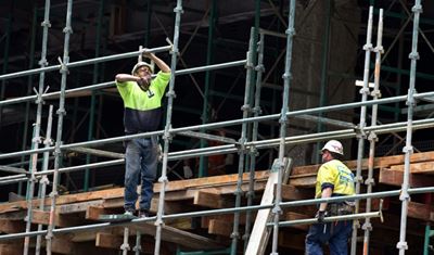 Australia keeps rates on hold at record low