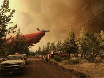 More residents flee as fires ravage western Canada