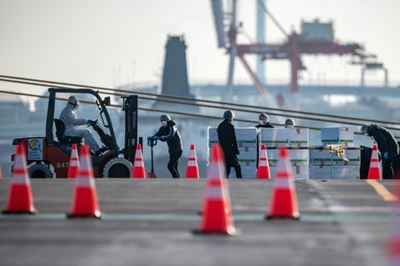 Two more Japan officials aboard ship contract coronavirus