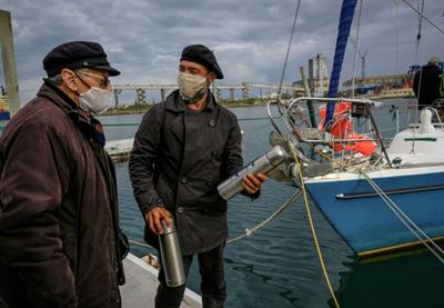 With no flights, Argentine sails across Atlantic to see parents