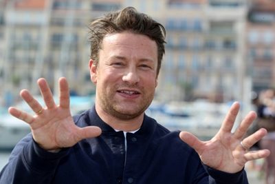 Celebrity chef Jamie Oliver serves time on restaurants