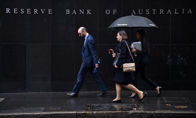 Australia cuts rates to historic low as economy slows