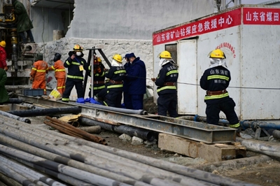 Rescuers say at least two more weeks to free Chinese miners