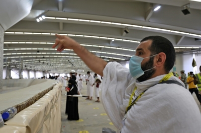 Pilgrims 'stone the devil' with sanitised pebbles in hajj ritual