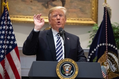Trump threatens to shoot migrants who throw stones at US military