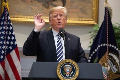 Trump threatens to shoot migrants who throw stones at US military