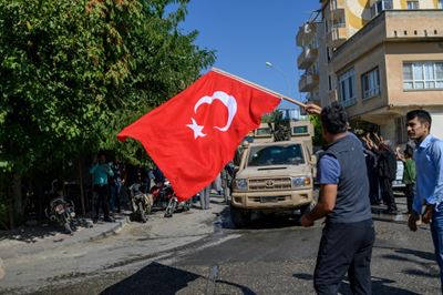 Pride and fear as shells rain down on Turkish border town