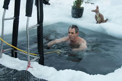 Antarctic researchers mark winter solstice with icy plunge
