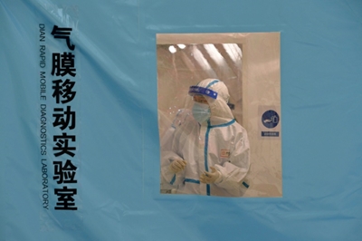 Third China city in lockdown on anniversary of first Covid death