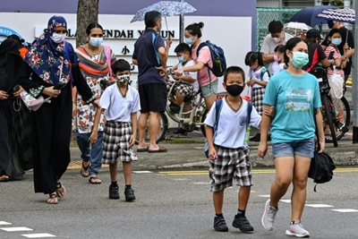 Singapore warns new virus strains infecting more children, shuts schools