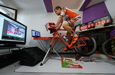 Triathlete racks up miles for good cause while going nowhere fast