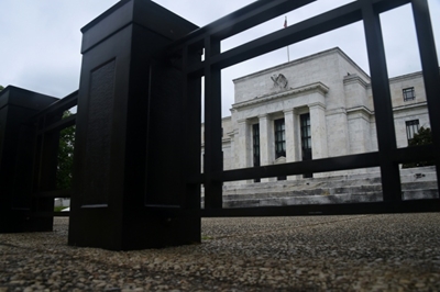 Fed more upbeat on US economy but will keep stimulus in place