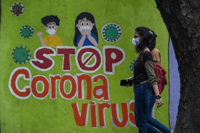 India hits 400,000 virus deaths as vaccinations slow