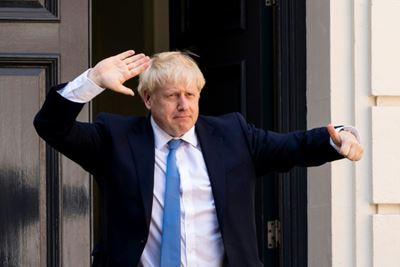 Merkel warns of Brexit economic pain before Johnson visit