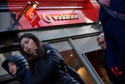 Vodafone slashes dividend after vast annual loss