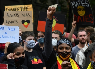 Thousands of Australians defy virus rules to protest 'Invasion Day'