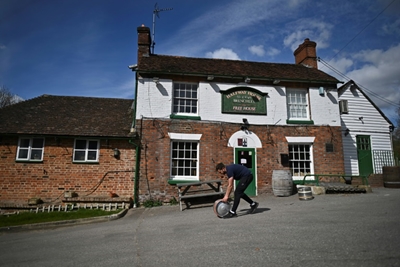English pubs set for comeback, India battles record virus surge