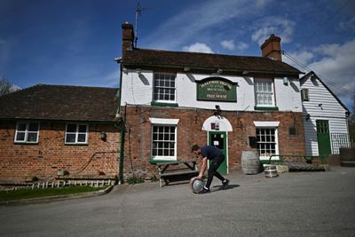English pubs set for comeback, India battles record virus surge