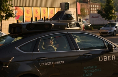 Toyota pours $500 mn into driverless car tie-up with Uber