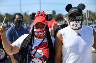 California theme parks remain shut but hundreds flock to Disney shops 