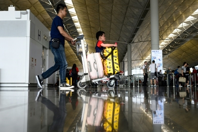 Stranded passengers voice support for Hong Kong protesters