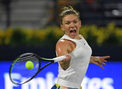 Halep grinds out win on return to court in Prague
