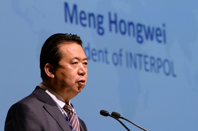 China's former Interpol chief pleads guilty to bribery