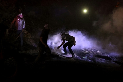 Tyres, fires, lasers: Palestinians smoke out settlers