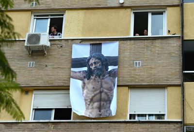 Locked-down Spain celebrates Holy Week with music and humour