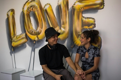 Young Venezuelans turn to adult content to survive crisis