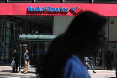 Bank of America profits fall as it reserves for bad loans