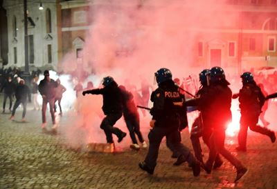 Italy imposes tough virus curbs as US cases hit record highs 