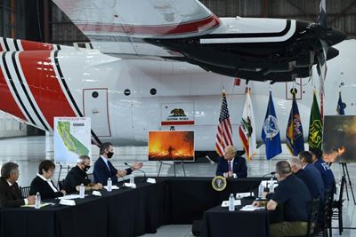 Trump predicts climate to cool down in wildfires briefing