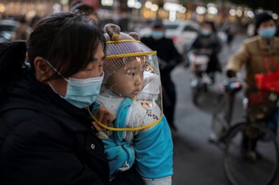 WHO team due in Wuhan as China reports first virus death in months