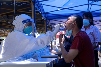 China limits travel in most populous province over Covid-19 cases