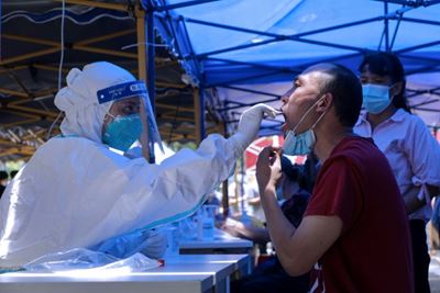 China limits travel in most populous province over Covid-19 cases